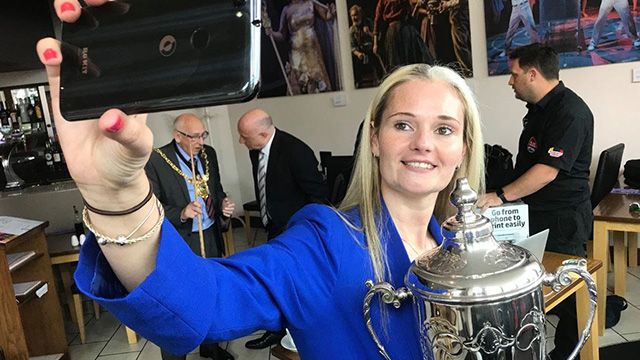 And of course with her choice of phone, a quick selfie with the Women’s World Championship trophy. 